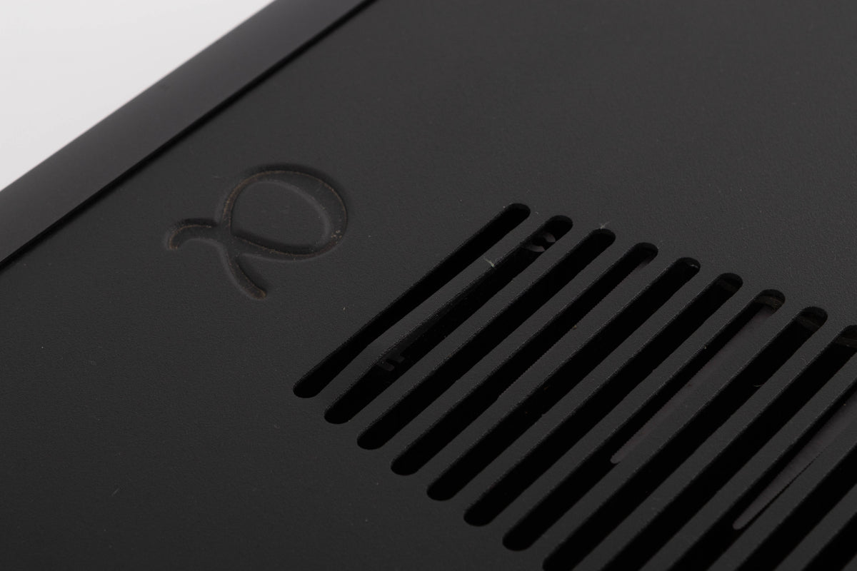 Close up of a used Arcam Alpha 9 Power Amplifier in a Black finish showing dent in vent on top