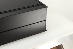 Close up view of a used Arcam Alpha II AM/FM Tuner showing a scratch on the back left corner