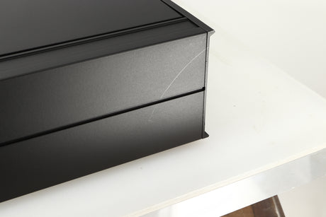 Close up view of a used Arcam Alpha II AM/FM Tuner showing a scratch on the back left corner