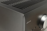 Close up of a used Arcam AVR30 AV Amplifier in a grey finish showing dink on front left corner