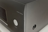 Close up of a used Arcam AVR30 AV Amplifier in a grey finish showing nick on front right corner