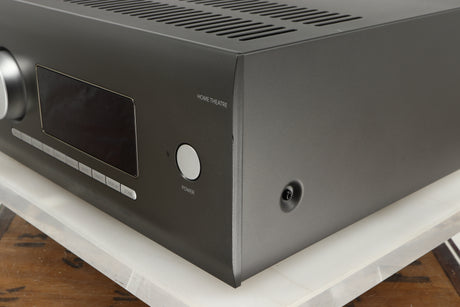 Front right corner of a used Arcam AVR30 AV Amplifier in a grey finish