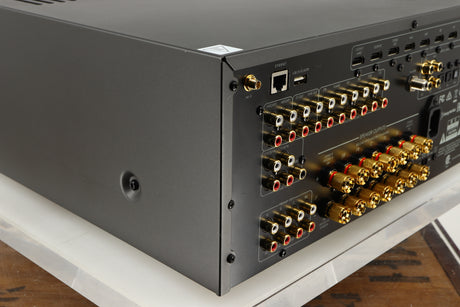Rear right corner of a used Arcam AVR30 AV Amplifier in a grey finish