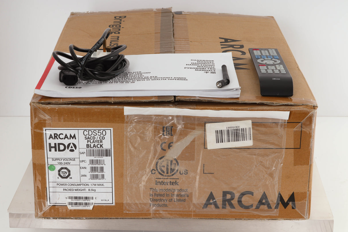 Box of a used Arcam CD550 CD Player / Streamer with mains cable, manual, remote, and antenna