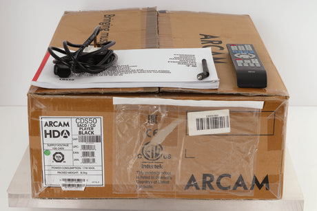 Box of a used Arcam CD550 CD Player / Streamer with mains cable, manual, remote, and antenna