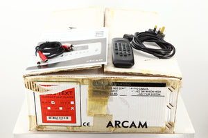 Box of a used Arcam CD73T CD Player in Black finish showing manual, mains cable, remote, and interconnects