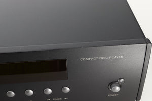 Close up view of a used Arcam CD73T CD Player in Black finish showing some small dents and scratches on the front edge