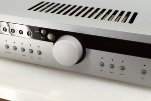 Close up of a used Arcam Diva A85 Integrated Amplifier in a silver finish showing some of the fascia