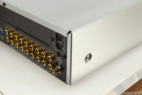 Rear left corner of a used Arcam Diva A85 Integrated Amplifier in a silver finish