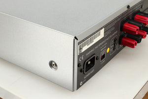 Rear right corner of a used Arcam Diva A85 Integrated Amplifier in a silver finish