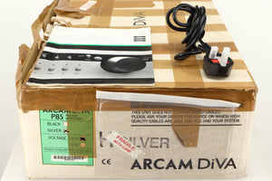 Box for a used Arcam P85/3 Power Amplifier in a silver finish showing Manual and Mains Cable