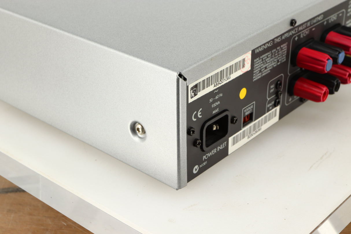 Rear right corner of a used Arcam P85/3 Power Amplifier in a silver finish
