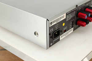 Rear right corner of a used Arcam P85/3 Power Amplifier in a silver finish