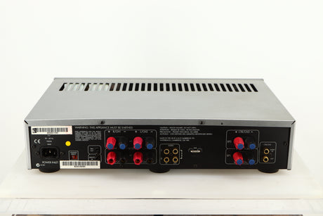 Rear view of a used Arcam P85/3 Power Amplifier in a silver finish showing Mains Input, Phono Inputs and Phono Outputs