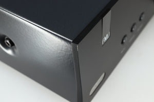 Close up of a used Arcam FMJ A19 Integrated Amplifier in a black finish showing light scratch on front left corner 