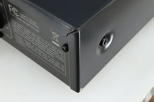 Close up of a used Arcam FMJ A19 Integrated Amplifier in a black finish showing small blemish
