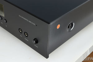 Front right corner of a used Arcam FMJ A19 Integrated Amplifier in a black finish