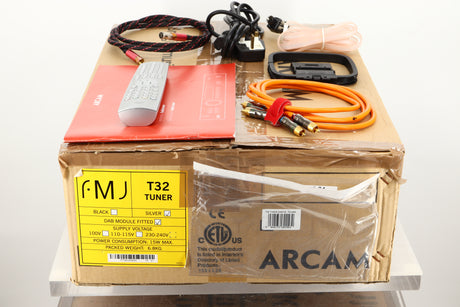 Box of a used Arcam FMJ T32 FM / DAB Tuner showing Indoor Ribbon Aerial, Remote, Interconnect Cable, Mains Cable, Square Loop Antenna and Manual