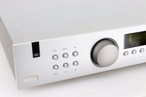 Close up of a used Arcam FMJ T32 FM / DAB Tuner in a silver finish showing some of the fascia