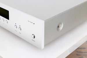 Front right corner of a used Arcam FMJ T32 FM / DAB Tuner in a silver finish