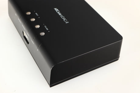 Close up of a used Arcam ir-DAC-II Digital Analogue Converter in a black finish showing light scratch on right side