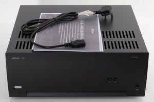 Top of a used Arcam P349 Power Amplifier in a Black finish showing Manual and Mains Cable