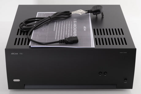 Top of a used Arcam P349 Power Amplifier in a Black finish showing Manual and Mains Cable