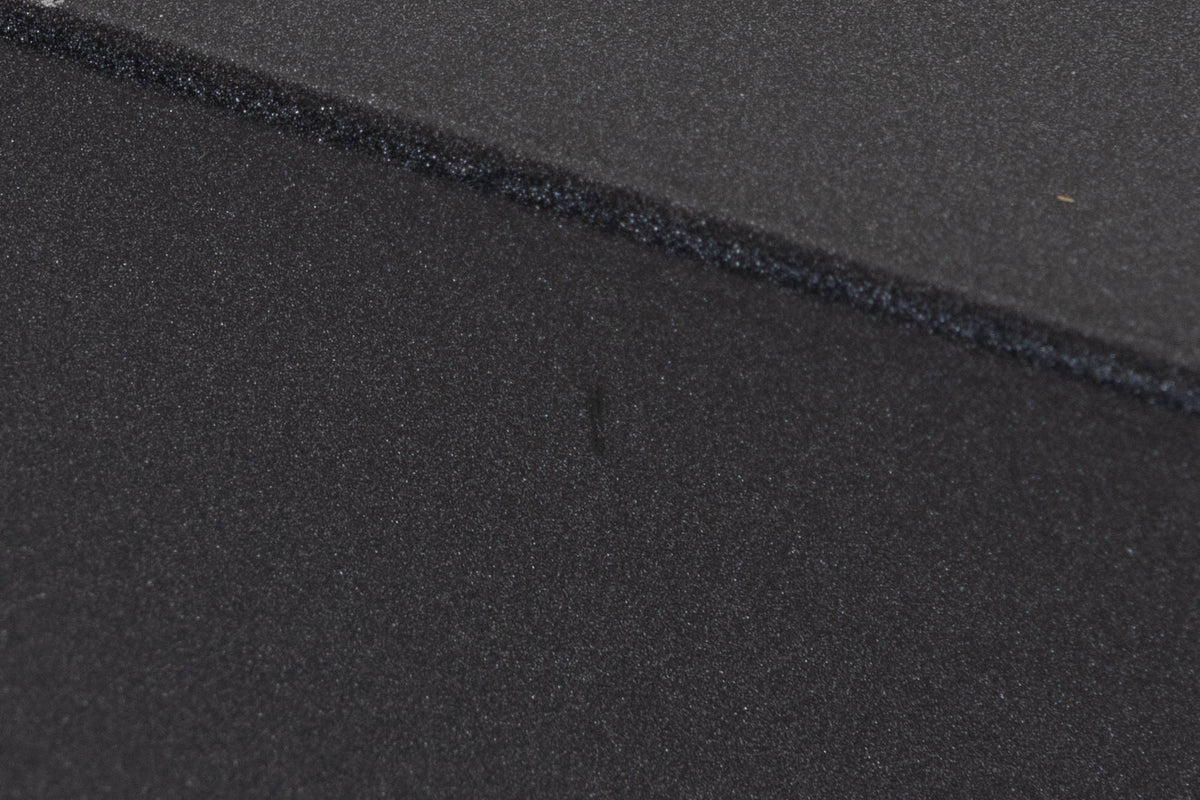 Close up of a used Arcam P349 Power Amplifier in a Black finish showing small nick on left side