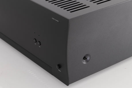 Front right corner of a used Arcam P349 Power Amplifier in a Black finish