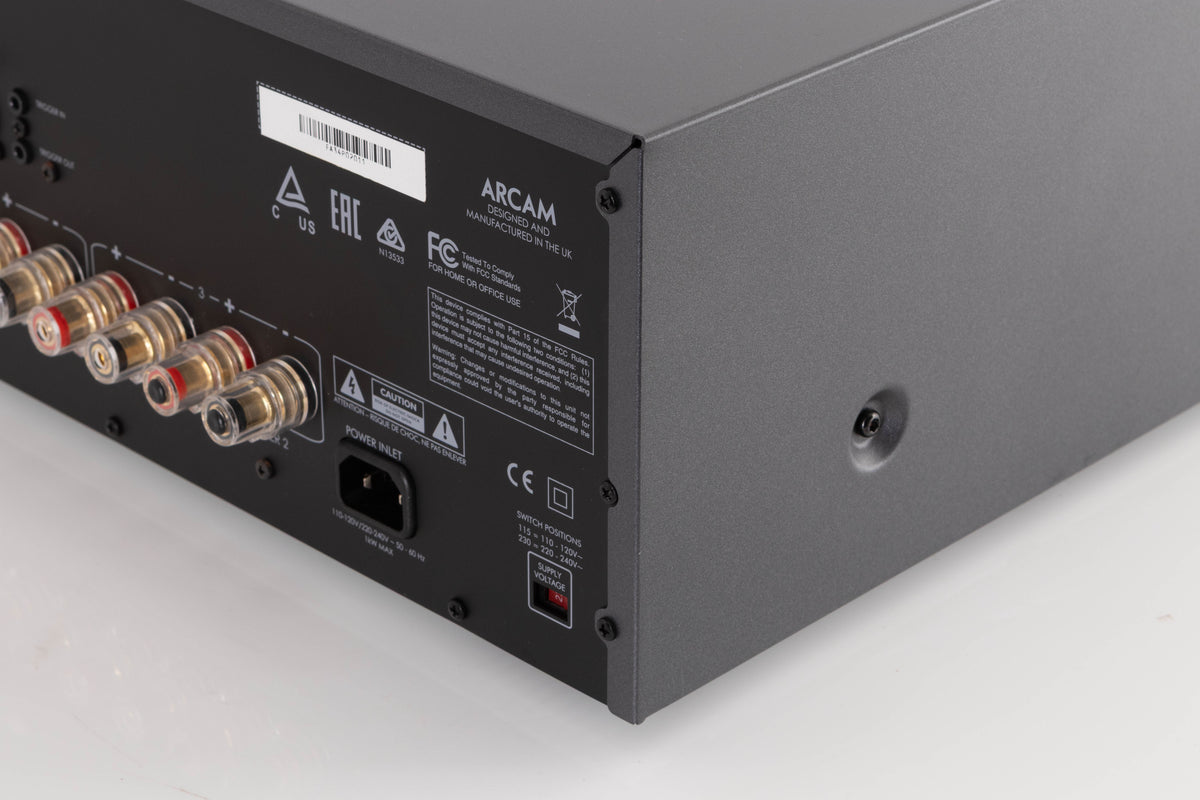 Rear left corner of a used Arcam P349 Power Amplifier in a Black finish