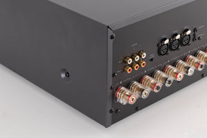 Rear right corner of a used Arcam P349 Power Amplifier in a Black finish