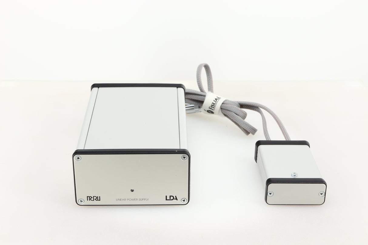 Front view of a used MCRU Power Supply in a silver finish