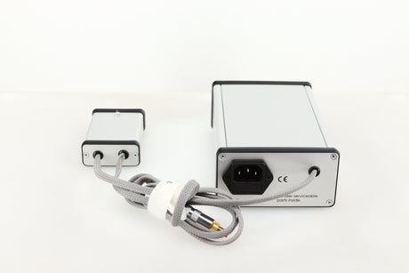 Rear view of a used MCRU Power Supply in a silver finish showing Mains Input