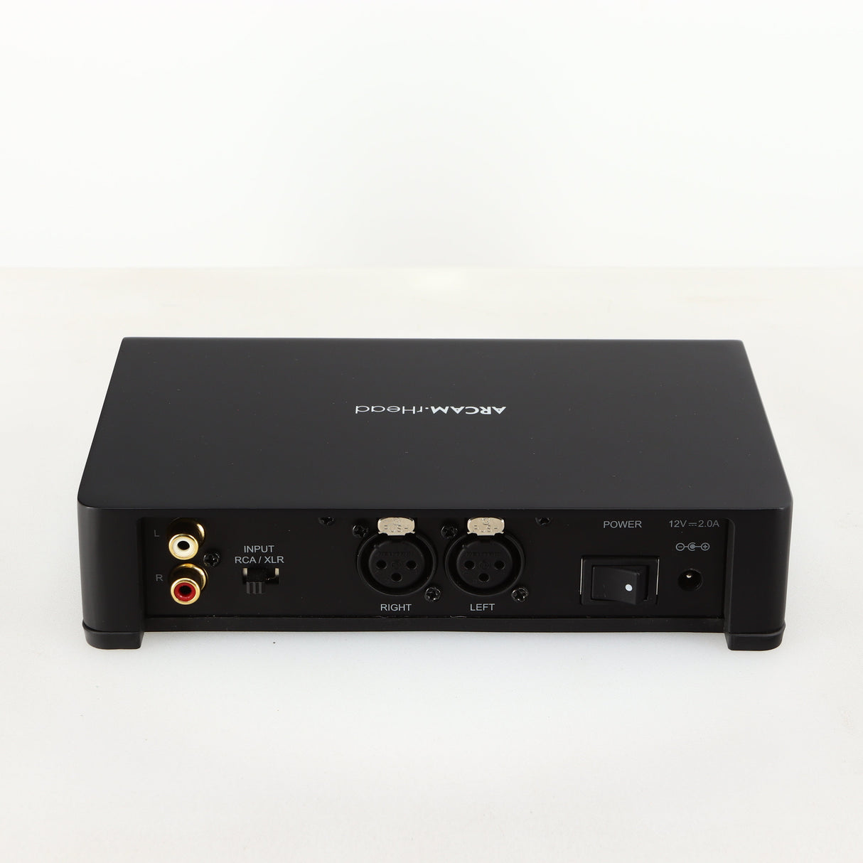 Rear view of a used Arcam rHead Headphone Amplifier in a black finish showing Phono Inputs and Power Input
