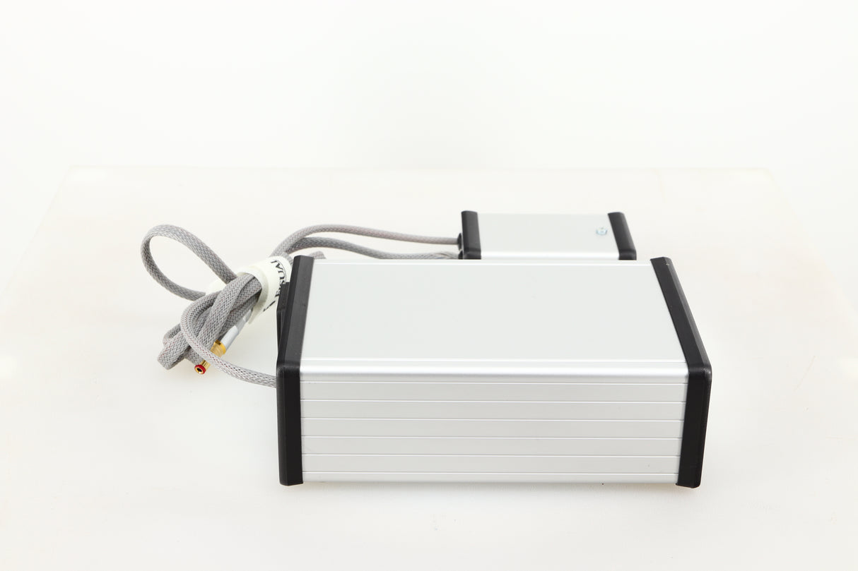 Left side view of a used MCRU Power Supply in a silver finish