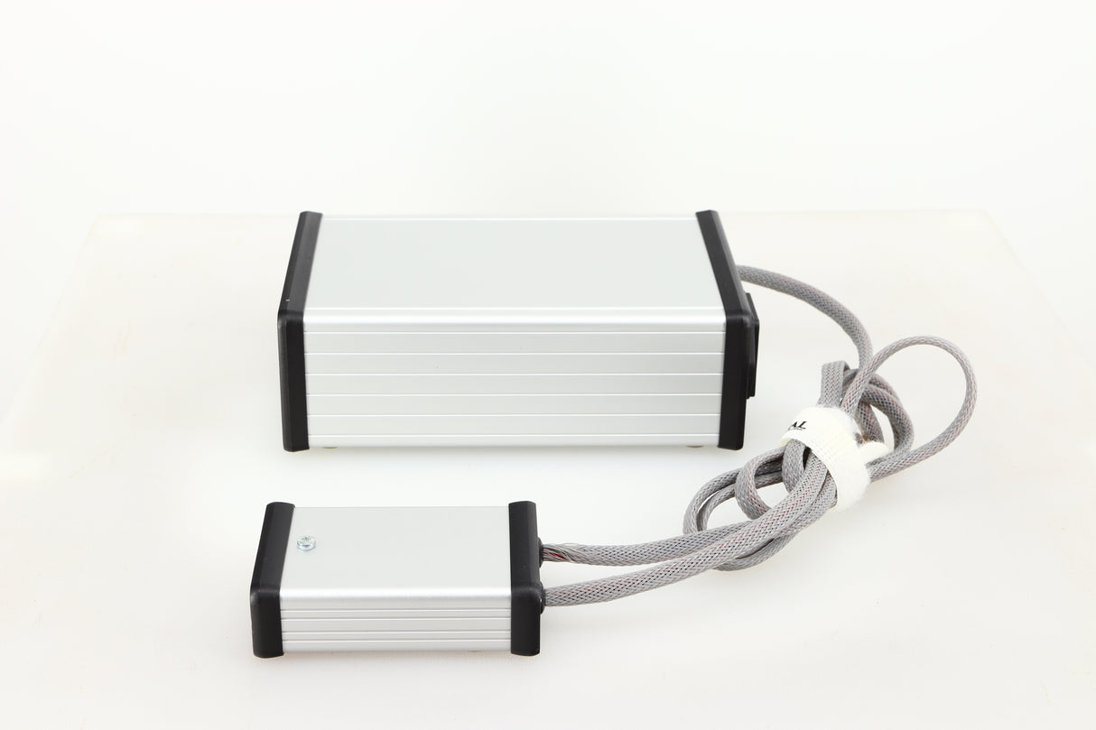 Right side view of a used MCRU Power Supply in a silver finish
