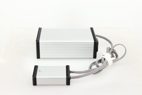 Right side view of a used MCRU Power Supply in a silver finish