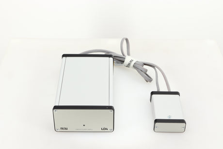 Top of a used MCRU Power Supply in a silver finish