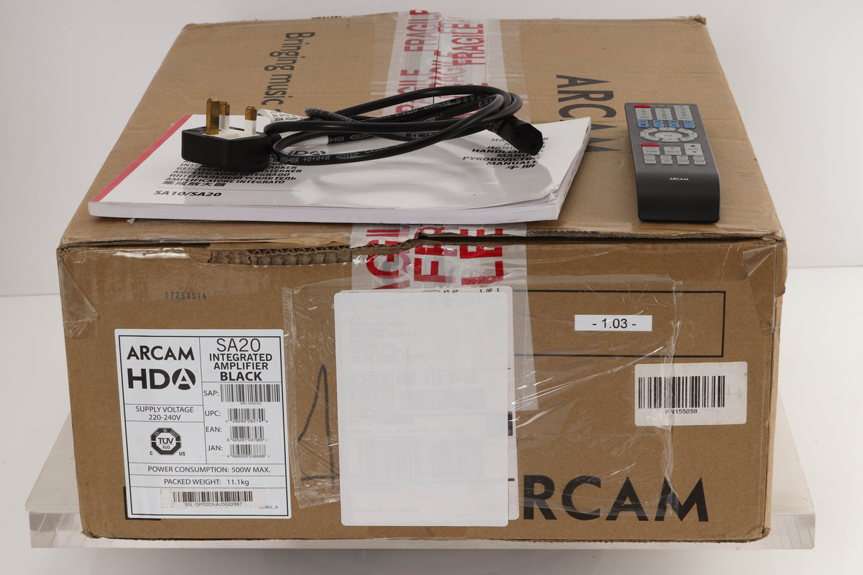 Box of a used Arcam SA20 Integrated Amplifier with mains cable, manual, and remote