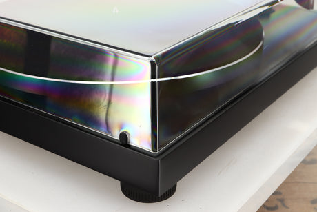 Front left corner of a used Argon TT-3 PLUS Turntable / Ortofon 2M Red Cartridge in a black finish
