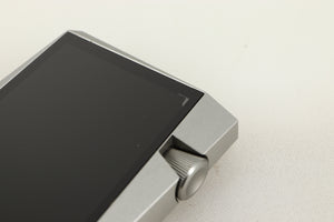 Close up view of a used Astell & Kern SR25 64gb Player in Silver finish showing screen delamination