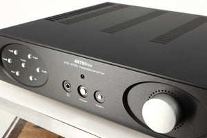 Close up of a used Astin Trew AT2-2100 Integrated Amplifier in a black finish showing some of the fascia