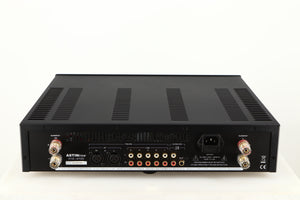 Rear view of a used Astin Trew AT2-2100 Integrated Amplifier in a black finish showing Phono Inputs, Phono Outputs, XLR Inputs, Mains Input and Speaker Outputs