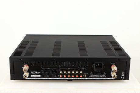 Rear view of a used Astin Trew AT2-2100 Integrated Amplifier in a black finish showing Phono Inputs, Phono Outputs, XLR Inputs, Mains Input and Speaker Outputs