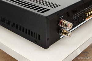 Rear left corner view of an Astin Trew AT2-2100 Integrated Amplifier in Red finish