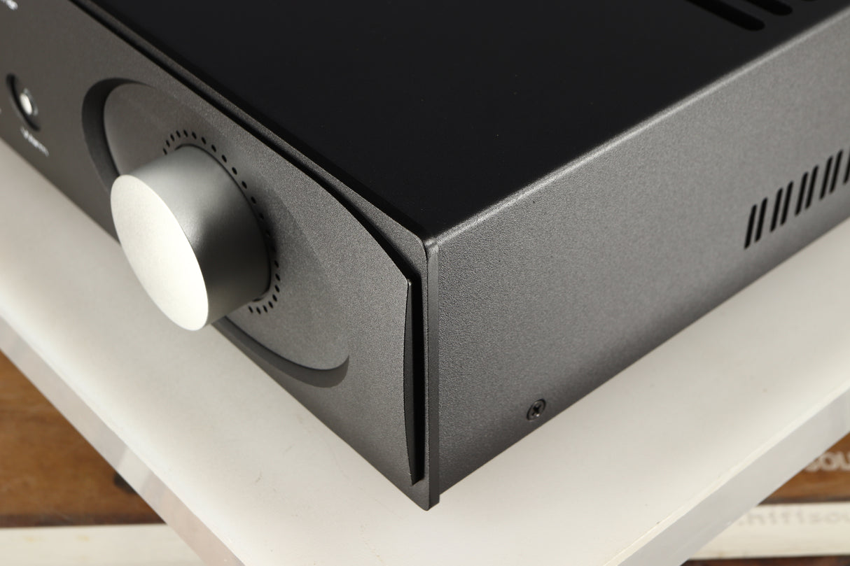 Front right corner of a used Astin Trew AT2-2100 Integrated Amplifier in a black finish