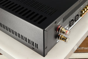 Rear right corner of a used Astin Trew AT2-2100 Integrated Amplifier in a black finish