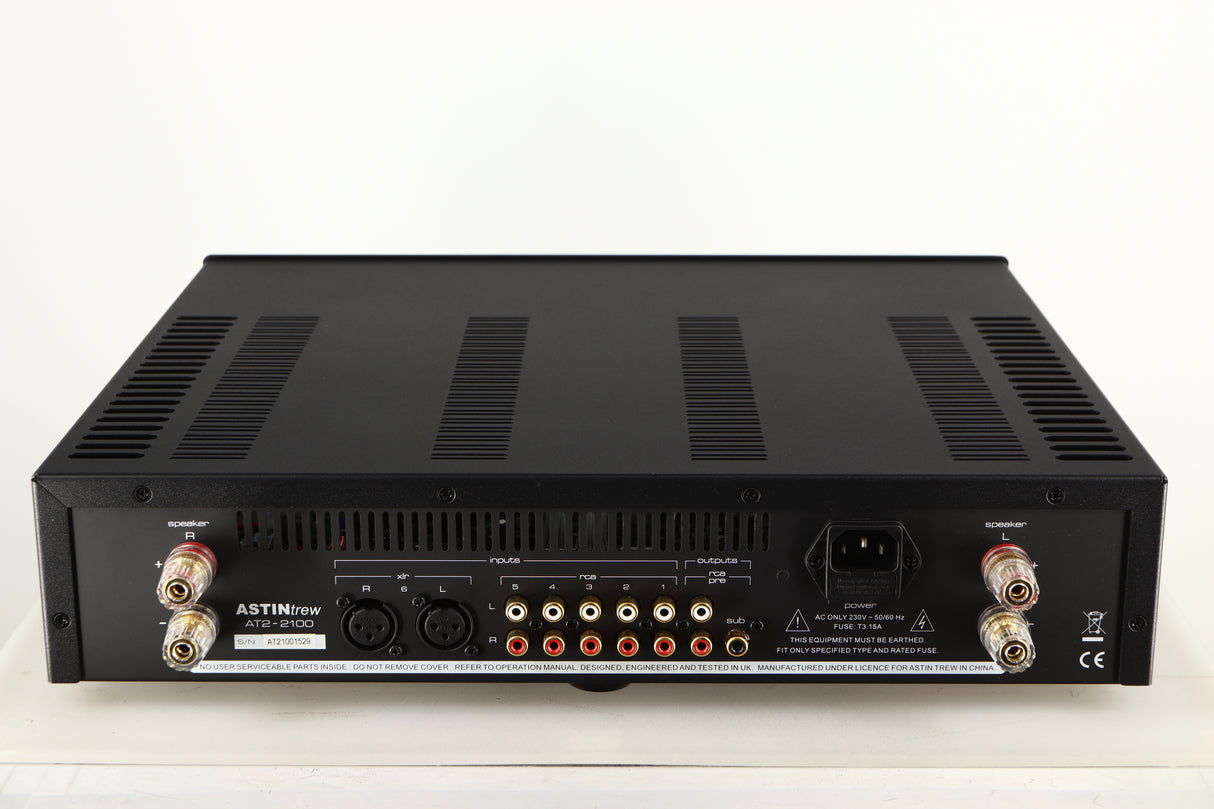 Rear view of a used Astin Trew AT2-2100 Integrated Amplifier in a black finish showing Phono Inputs, Phono Outputs, Mains Input, XLR Inputs and Speaker Outputs