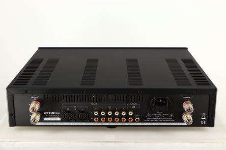 Rear view of a used Astin Trew AT2-2100 Integrated Amplifier in a black finish showing Phono Inputs, Phono Outputs, Mains Input, XLR Inputs and Speaker Outputs