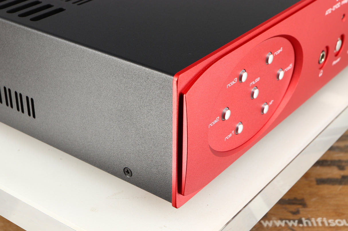 Front left corner of a used Astin Trew AT2-2100 Integrated Amplifier in a red finish
